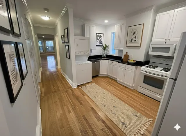 a kitchen with stainless steel appliances a refrigerator and a stove top oven