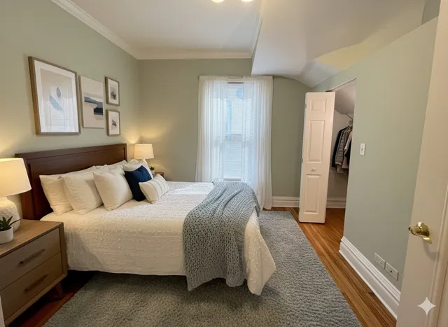 a bed room with a bed and a walk in closet