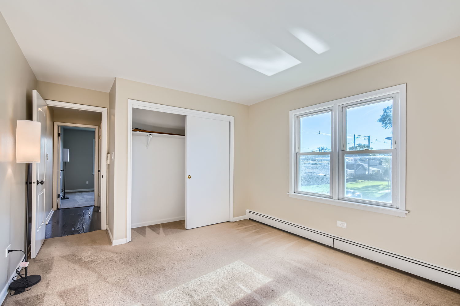 10767 South Pulaski Road, Unit 5 Chicago, IL 60655 - Photo 8 of 10 an empty room with windows and closet