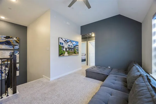 a living room with furniture and a walk in closet