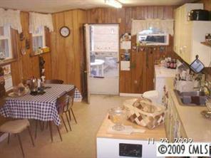 1093 Hopewell Church Road Hiddenite, NC 28636 - Photo 7 of 8 a view of a dining room with furniture