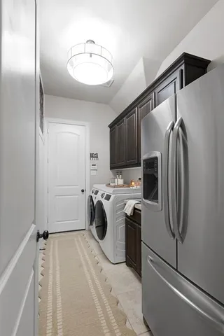 a very nice looking living room with a large window and furniture