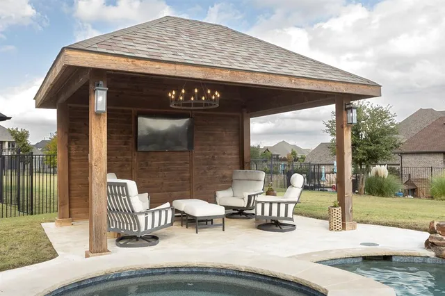 a view of a porch with furniture and yard
