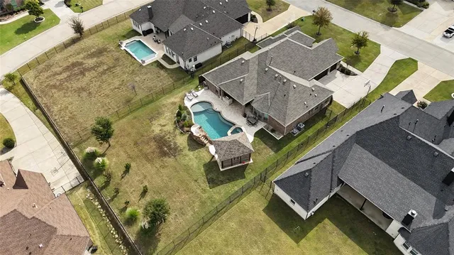 an aerial view of a house with outdoor space