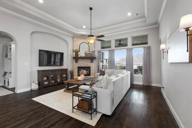 a living room with fireplace furniture and a flat screen tv