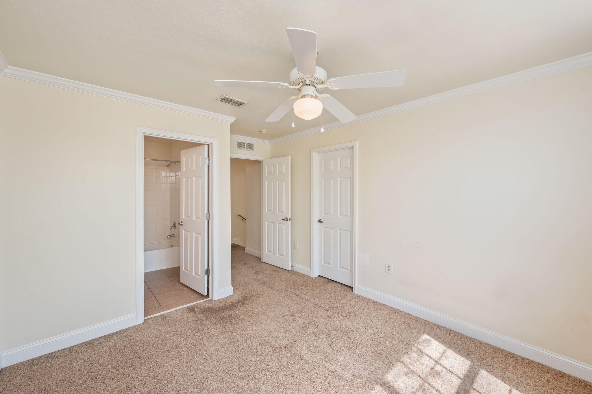 535 Wingspan Way Crestview, FL 32536 - Photo 16 of 26 an empty room with a ceiling fan and a window