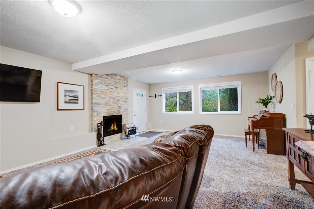 13621 196th Avenue Southeast Renton, WA 98059 - Photo 22 of 31 a bed room with a bed and a fireplace
