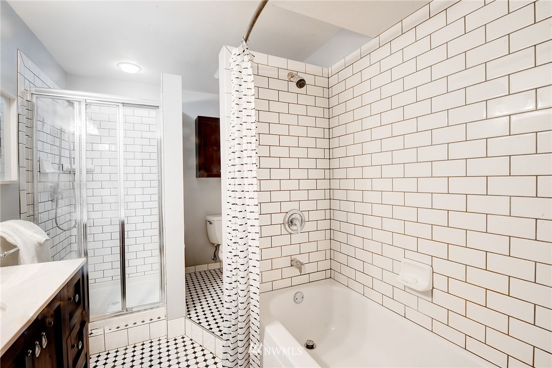 13621 196th Avenue Southeast Renton, WA 98059 - Photo 25 of 31 a bathroom with a bathtub and a shower