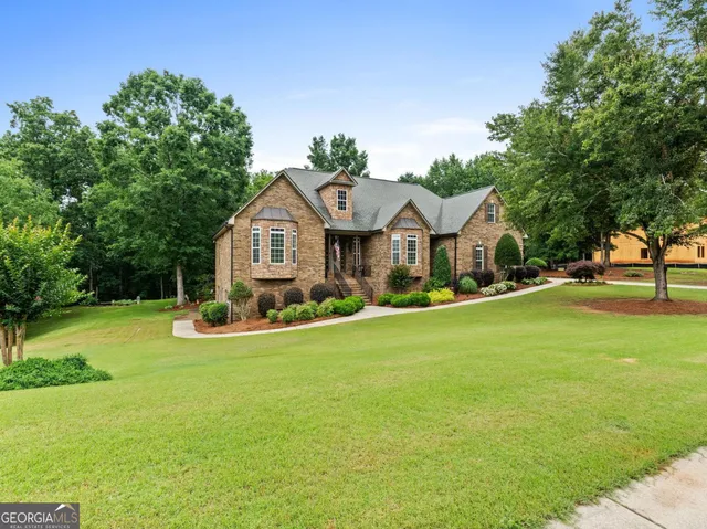a large kitchen with a table and chairs
