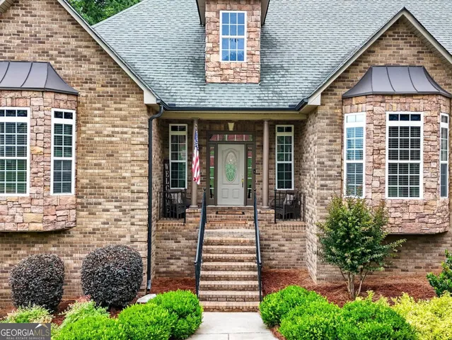a kitchen with stainless steel appliances a stove a microwave and a refrigerator