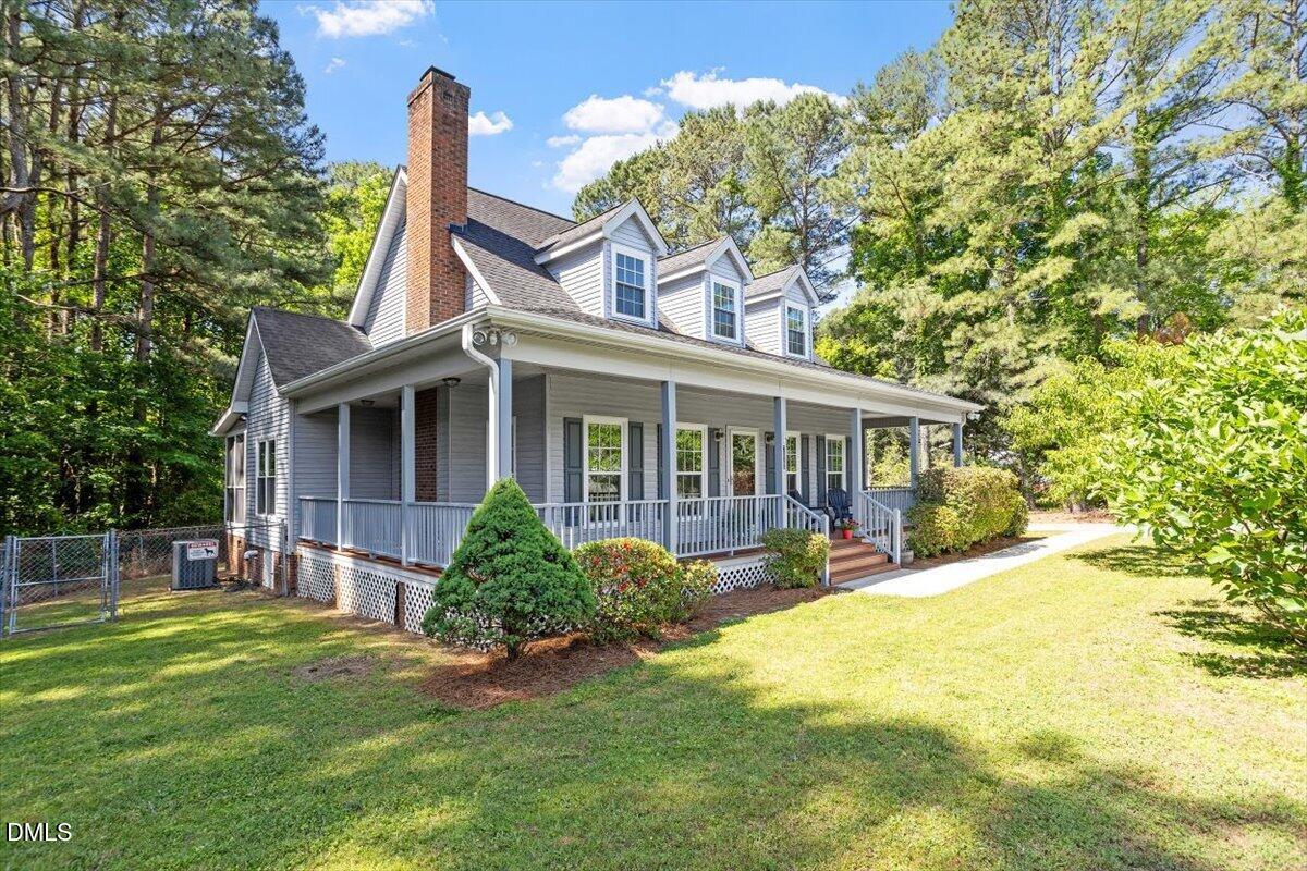 7505 Penny Road Raleigh, NC 27606 - Photo 2 of 35 a view of a house with a yard and plants