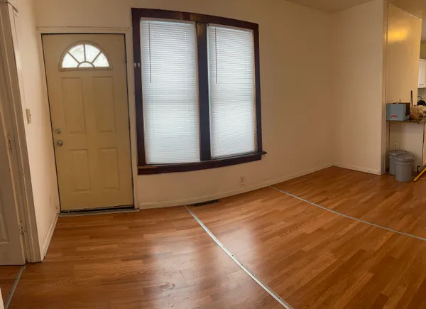 an empty room with a mirror