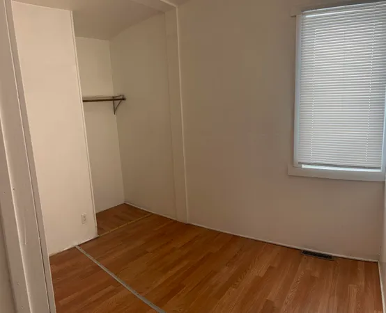 an empty room with a bench
