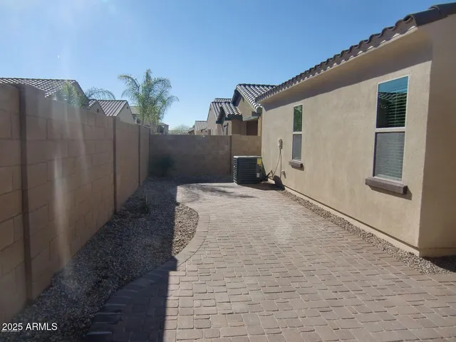 a very nice looking house with wooden fence