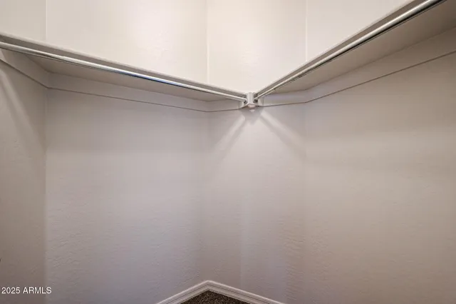 a bathroom with a sink a toilet a mirror and shower