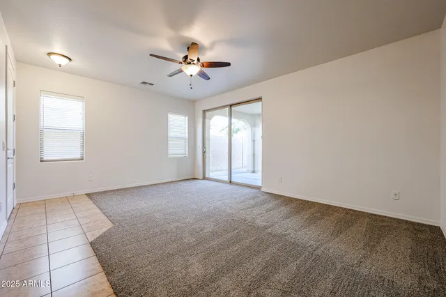 an empty room with sliding door and mirror view