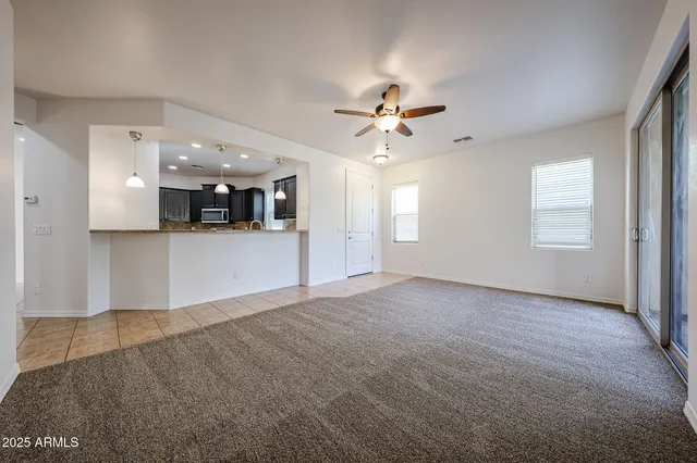 a kitchen with stainless steel appliances granite countertop a sink a stove and a refrigerator