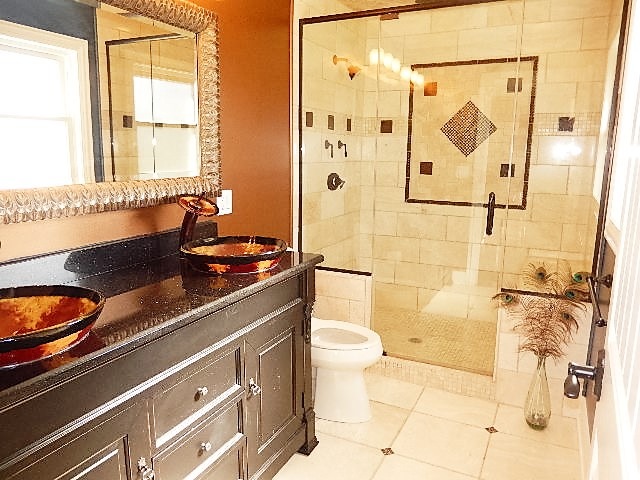 11215 79th Street Burr Ridge, IL 60527 - Photo 13 of 25 a bathroom with a granite countertop sink a toilet and shower