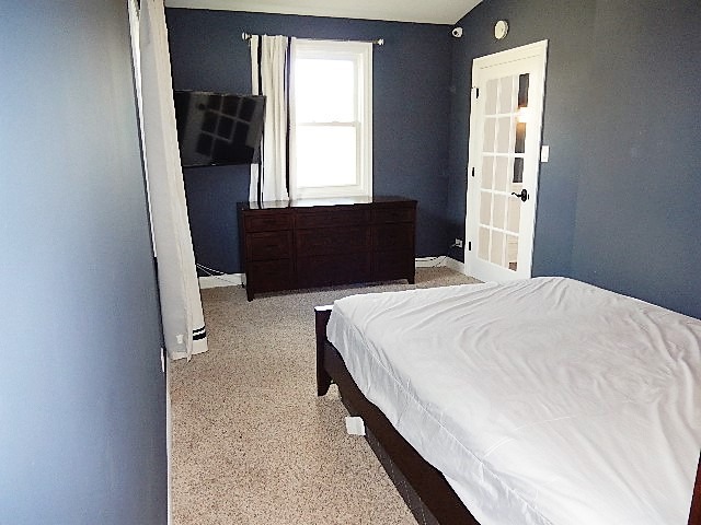 11215 79th Street Burr Ridge, IL 60527 - Photo 19 of 25 a bedroom with a bed and a window
