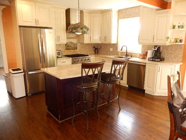 11215 79th Street Burr Ridge, IL 60527 - Photo 6 of 25 a kitchen with granite countertop a sink cabinets and stainless steel appliances