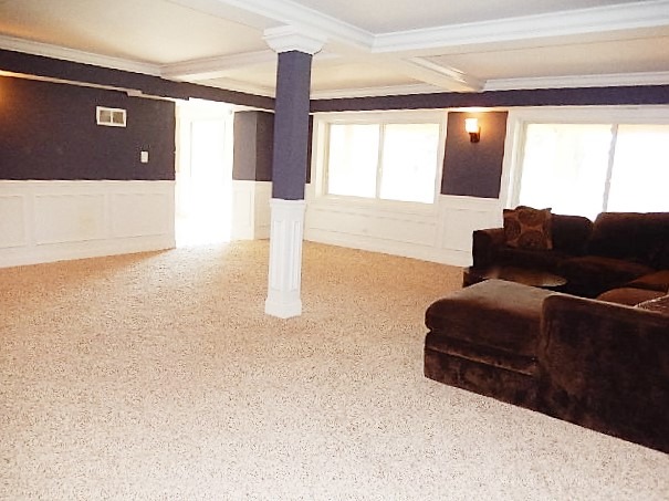 11215 79th Street Burr Ridge, IL 60527 - Photo 10 of 25 a living room with furniture and a floor to ceiling window