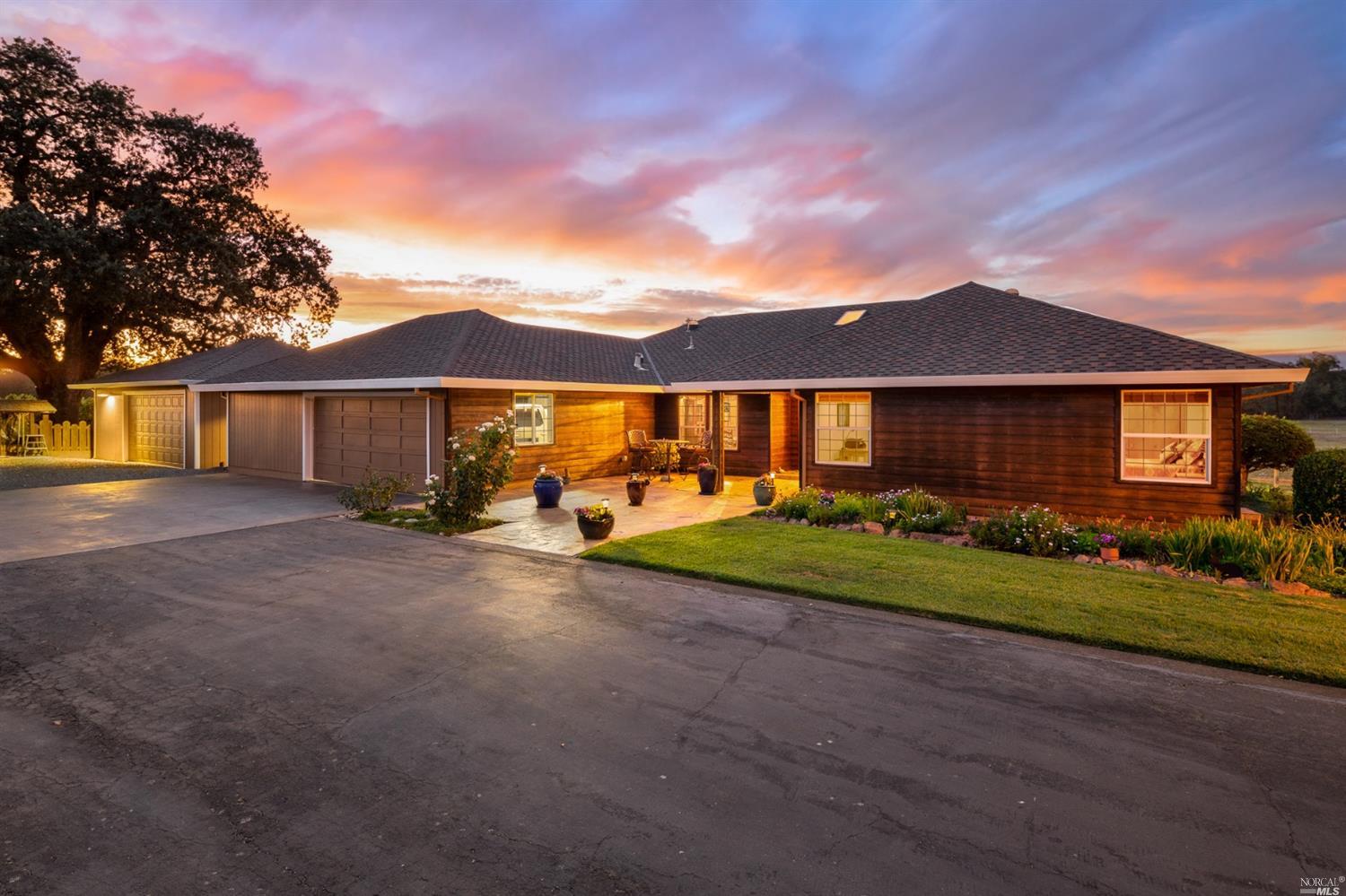 499 Sierra Vista Road Santa Rosa, CA 95401 - Photo 1 of 1 a view of a big house with a big yard and large trees