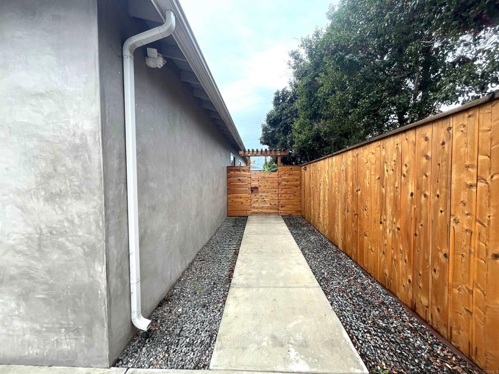 804-814 Clark Avenue Encinitas, CA 92024 - Photo 16 of 18 a view of balcony with wooden floor and fence