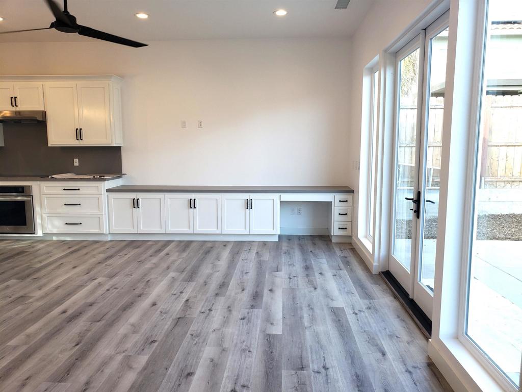 804-814 Clark Avenue Encinitas, CA 92024 - Photo 5 of 18 a view of kitchen with wooden floor and electronic appliances