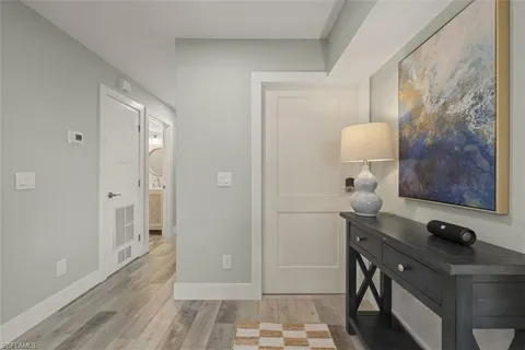 a view of bathroom with a toilet a sink and a mirror
