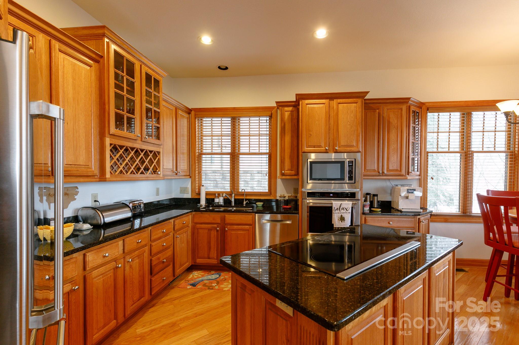 528 Andrew Banks Road, Unit A/3 Burnsville, NC 28714 - Photo 14 of 31 a kitchen with stainless steel appliances granite countertop a sink a stove and a refrigerator