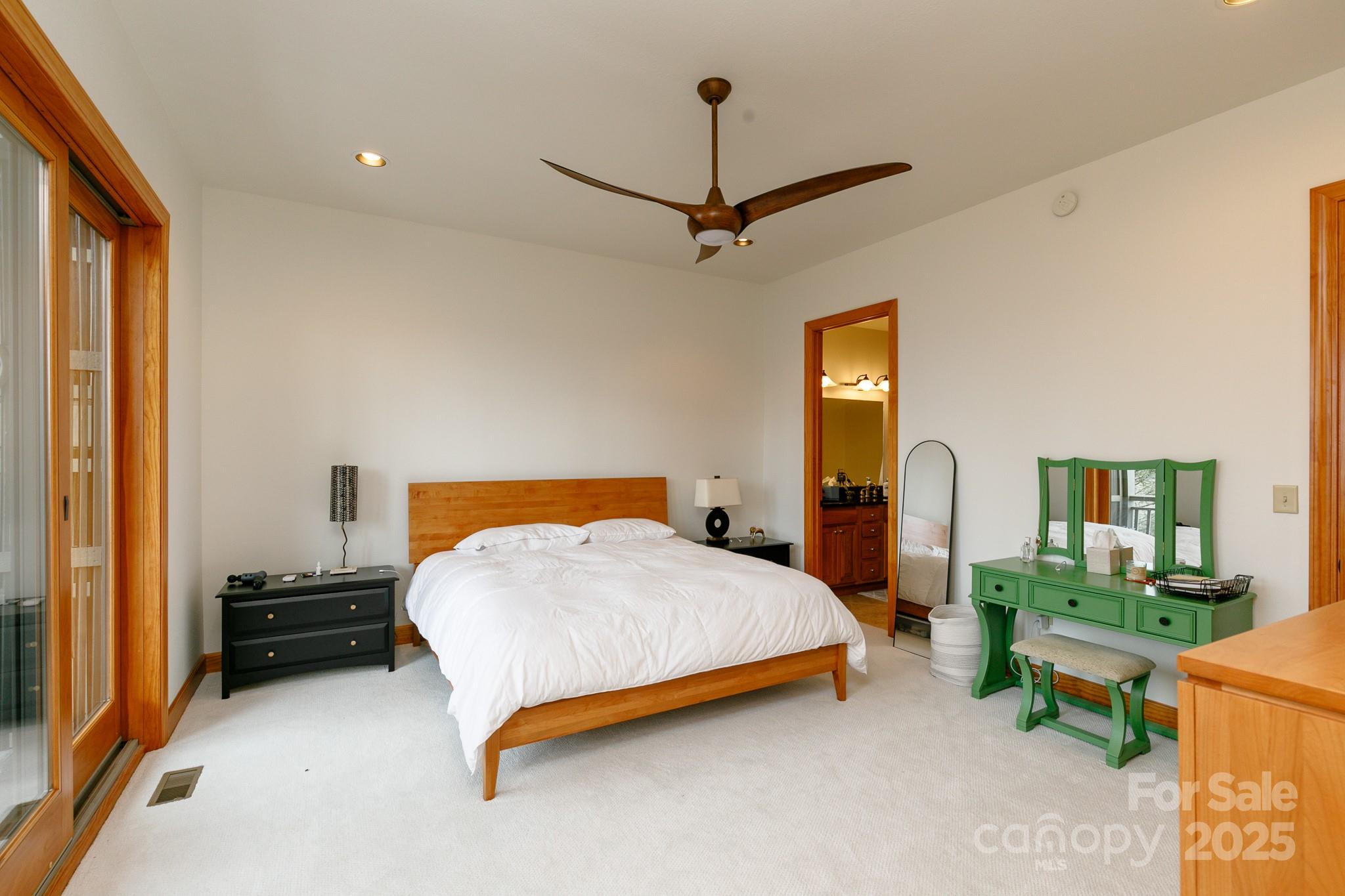 528 Andrew Banks Road, Unit A/3 Burnsville, NC 28714 - Photo 15 of 31 a bedroom with a bed a table and painting