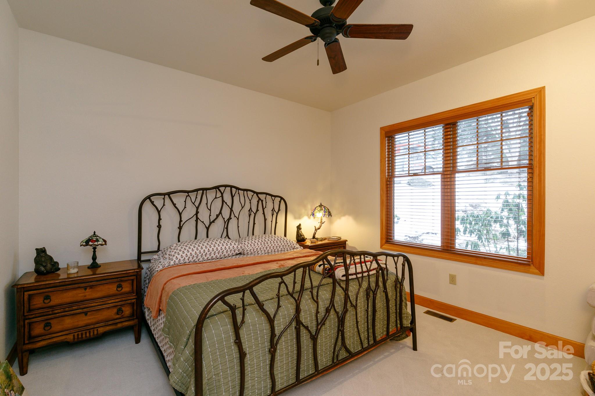 528 Andrew Banks Road, Unit A/3 Burnsville, NC 28714 - Photo 21 of 31 a bedroom with a bed and a window