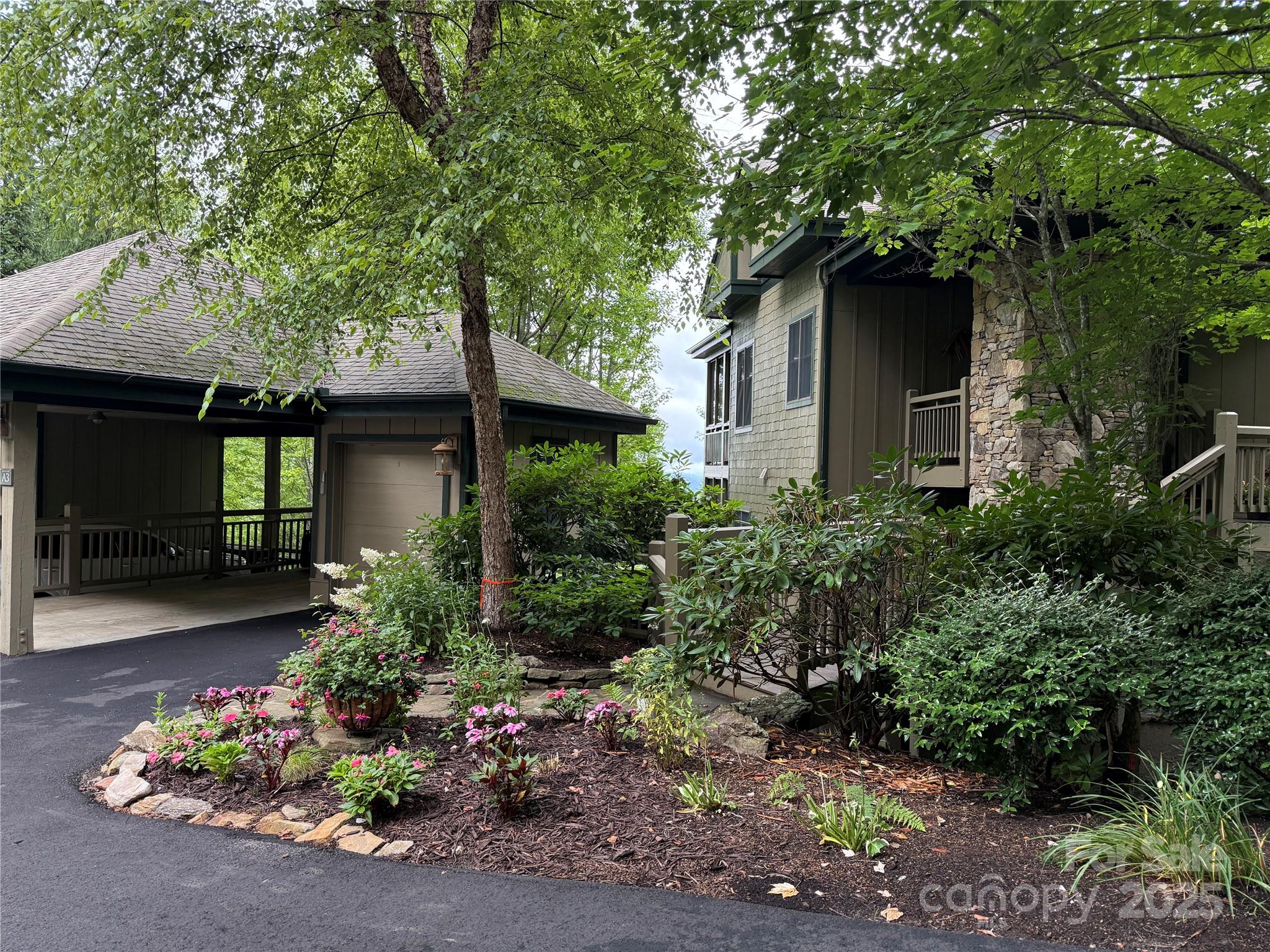 528 Andrew Banks Road, Unit A/3 Burnsville, NC 28714 - Photo 4 of 31 a front view of a house with a yard