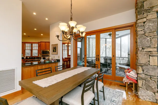 a large kitchen with a table and chairs