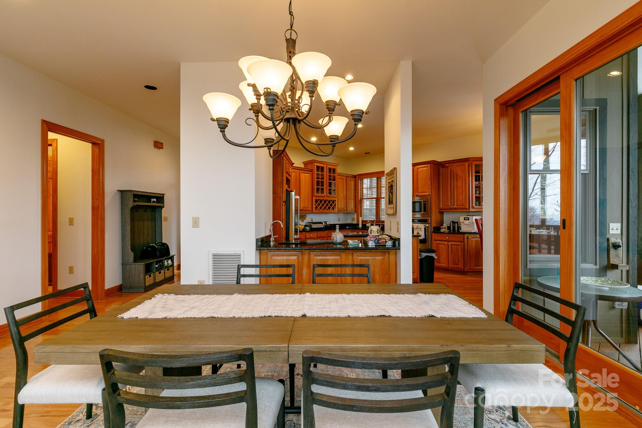 528 Andrew Banks Road, Unit A/3 Burnsville, NC 28714 - Photo 9 of 31 a view of a dining room with furniture window and wooden floor