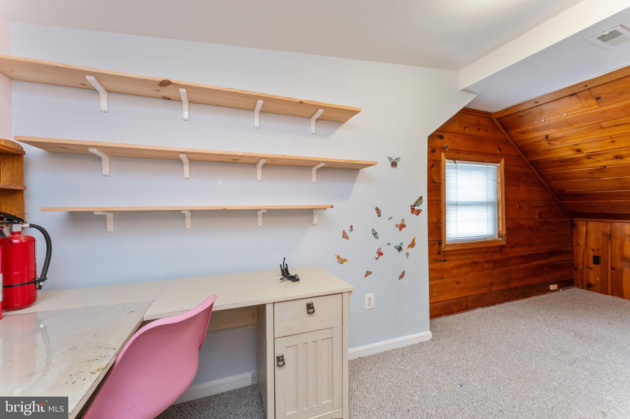 1609 Brisbane Street Silver Spring, MD 20902 - Photo 11 of 24 a view of walk in closet with clothes and shoes