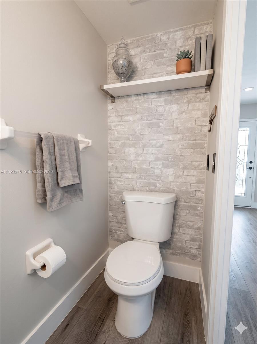 13 Southwest 3rd Street, Unit 13 Pompano Beach, FL 33060 - Photo 12 of 44 a bathroom with a toilet and a sink