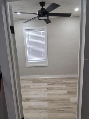 a view of an empty room with a window