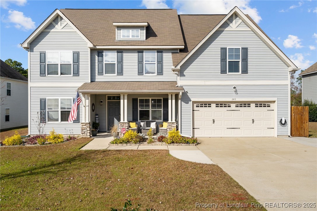 240 Heathrow Drive Spring Lake, NC 28390 - Photo 1 of 47 a front view of a house with sitting area