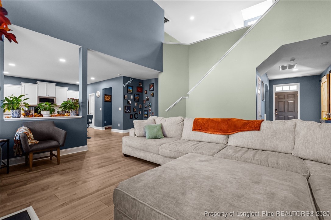 240 Heathrow Drive Spring Lake, NC 28390 - Photo 13 of 47 a living room with furniture and a large window