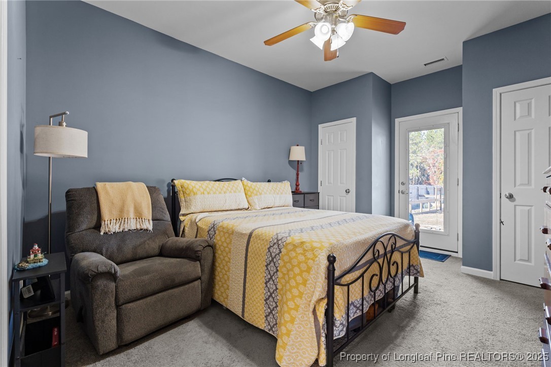 240 Heathrow Drive Spring Lake, NC 28390 - Photo 18 of 47 a bedroom with a bed couch and window