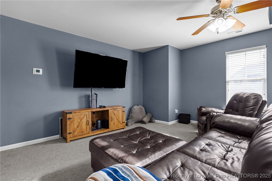 240 Heathrow Drive Spring Lake, NC 28390 - Photo 23 of 47 a living room with furniture and a flat screen tv