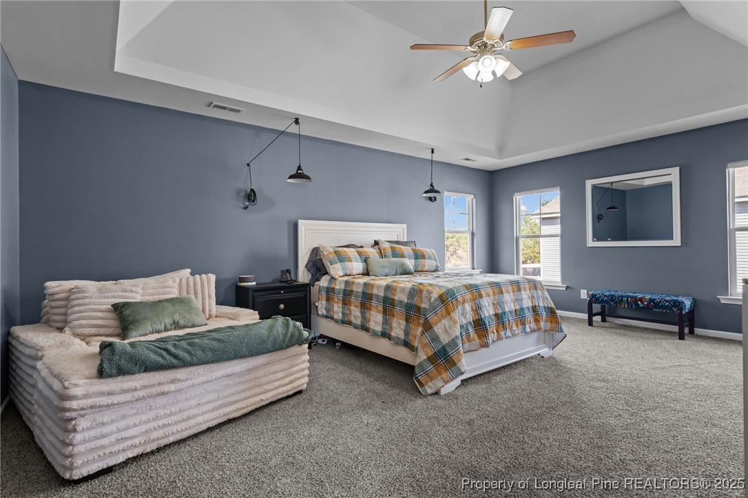 240 Heathrow Drive Spring Lake, NC 28390 - Photo 27 of 47 a bedroom with a bed couch and a ceiling fan
