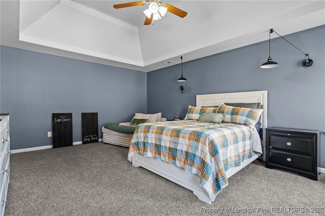 240 Heathrow Drive Spring Lake, NC 28390 - Photo 29 of 47 a bedroom with a bed and a ceiling fan