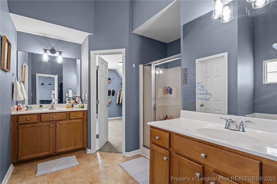 240 Heathrow Drive Spring Lake, NC 28390 - Photo 30 of 47 a bathroom with a granite countertop sink mirror and double