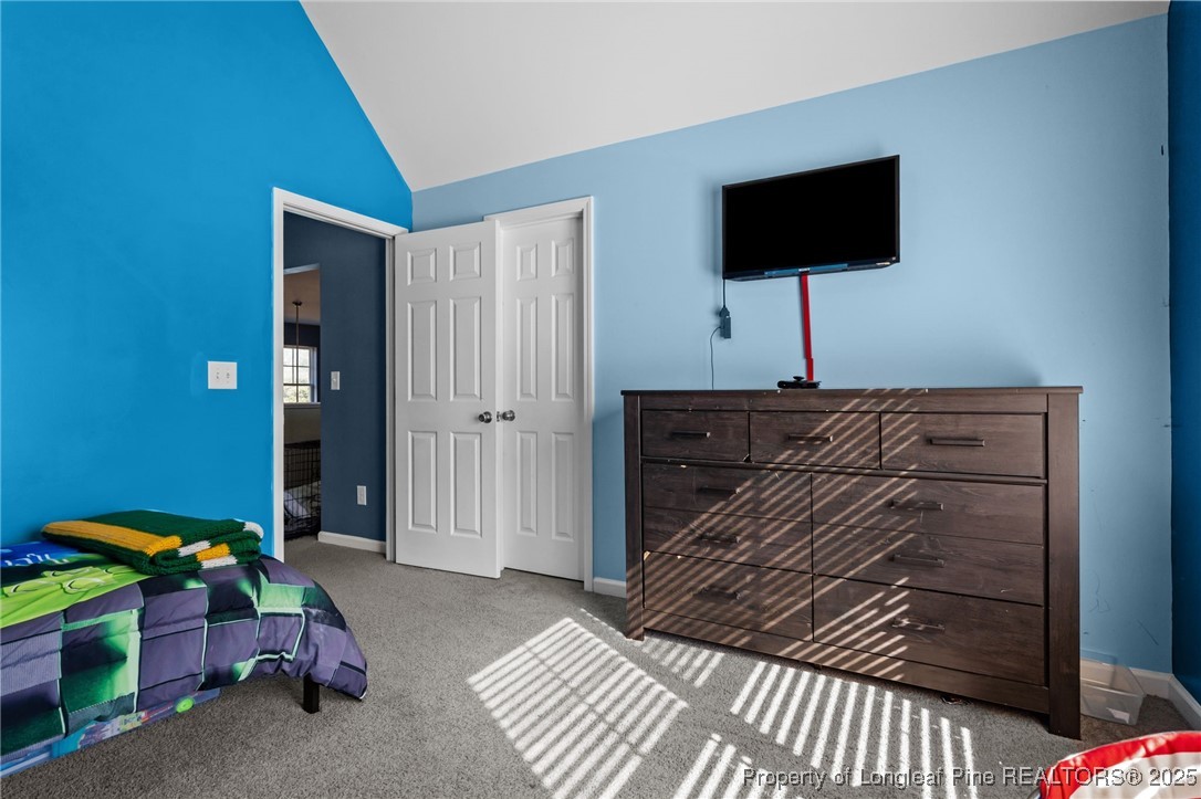 240 Heathrow Drive Spring Lake, NC 28390 - Photo 35 of 47 a bedroom with a bed and a television