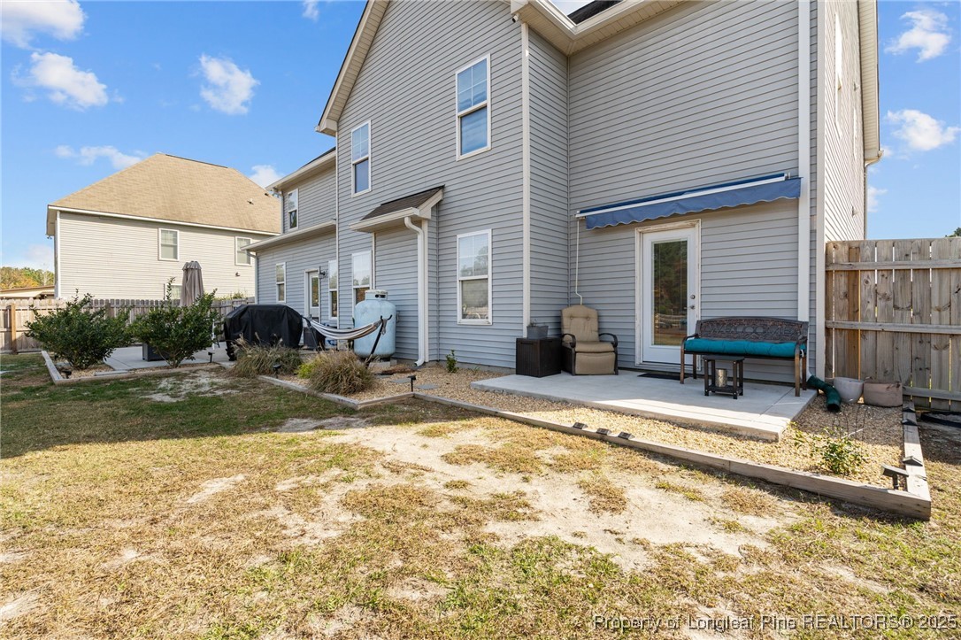240 Heathrow Drive Spring Lake, NC 28390 - Photo 40 of 47 a view of a backyard with a table and chairs and ice snow