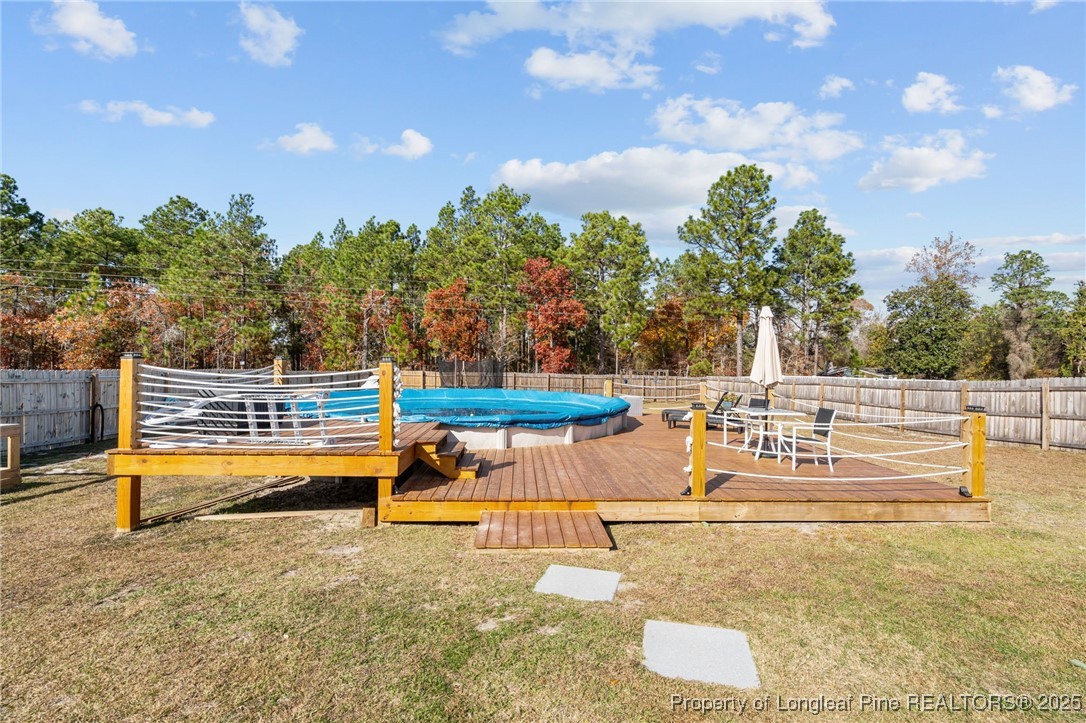 240 Heathrow Drive Spring Lake, NC 28390 - Photo 41 of 47 a view of a patio with swimming pool