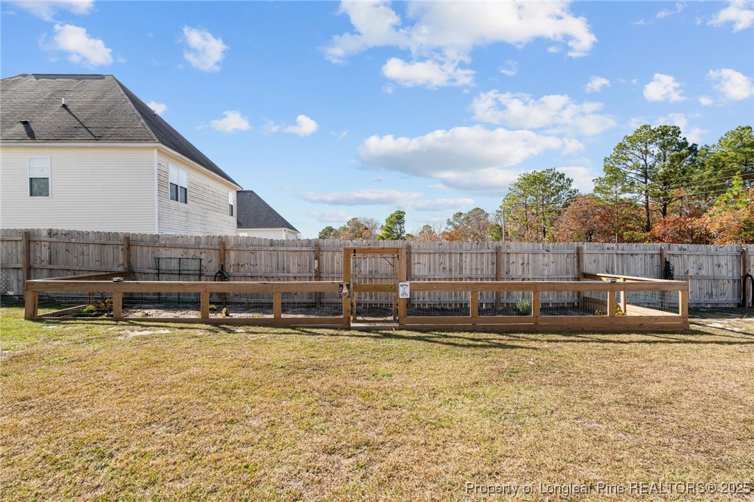 240 Heathrow Drive Spring Lake, NC 28390 - Photo 43 of 47 a view of a house with a yard