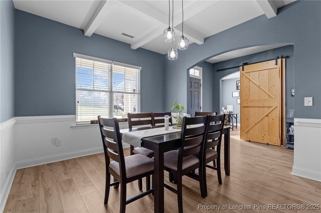 240 Heathrow Drive Spring Lake, NC 28390 - Photo 7 of 47 a view of a dining room with furniture window and wooden floor